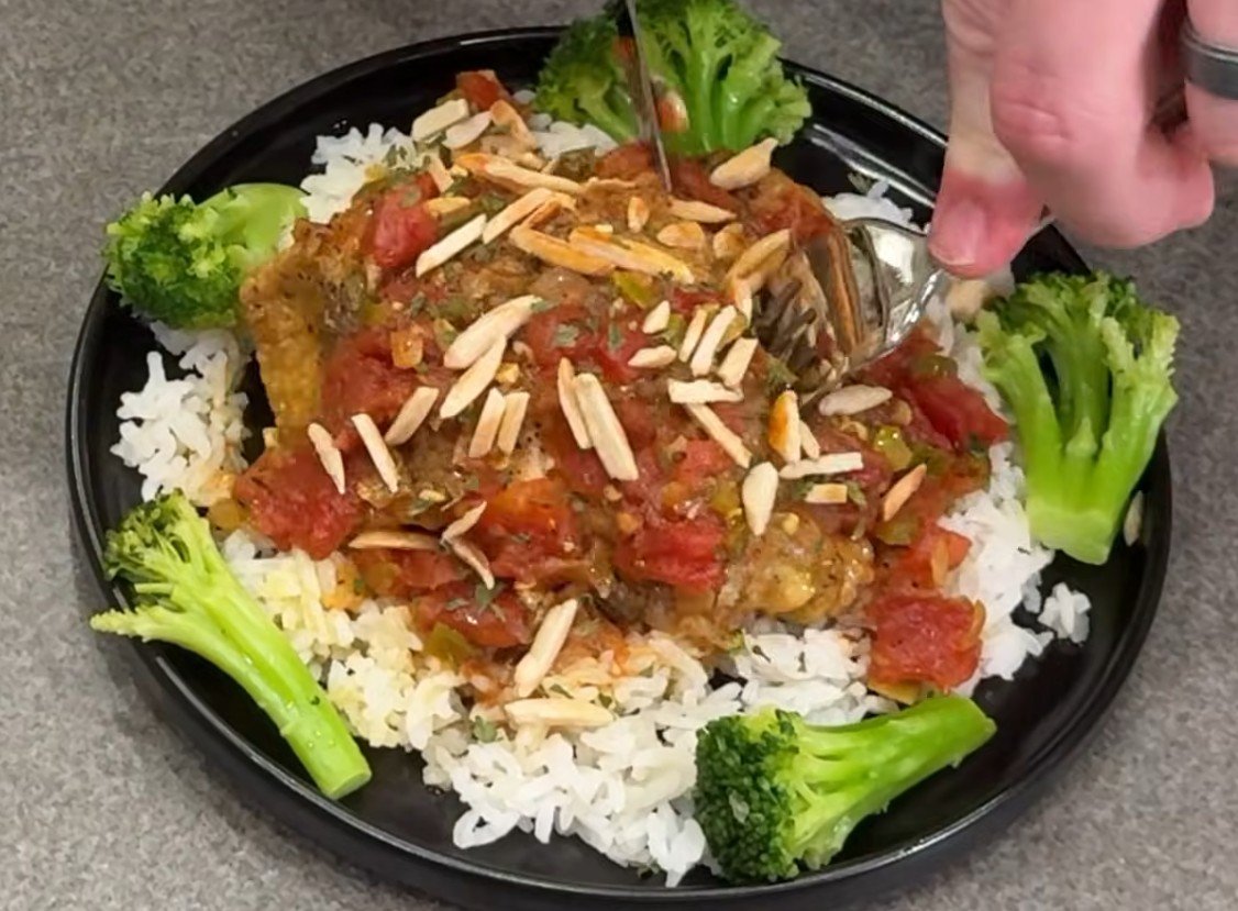 Spicy country curry chicken over rice with broccoli and toasted almonds